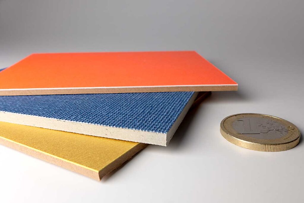 Graupappe mit Effektbeschichtungen aus Buchbinderleinen, Neonorange und Mattgold